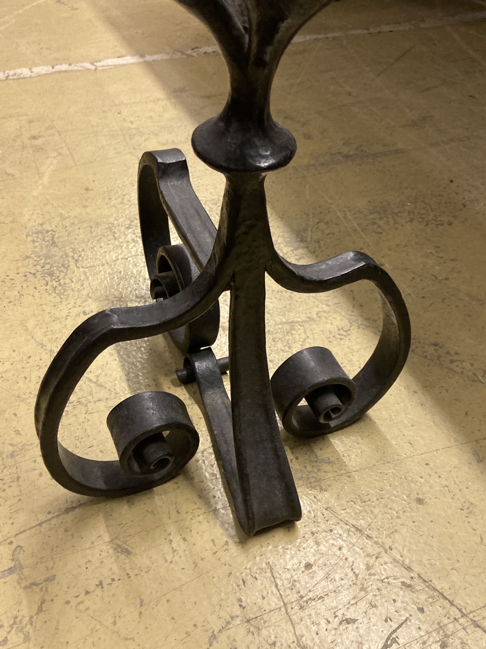A George III pierced steel serpentine fender, length 130cm, together with a pair of wrought iron firedogs